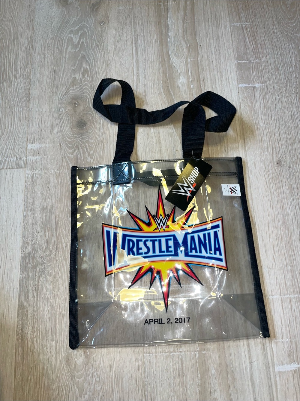 WWE Clear Tote Bag with Black Handles and Colorful WrestleMania Logo